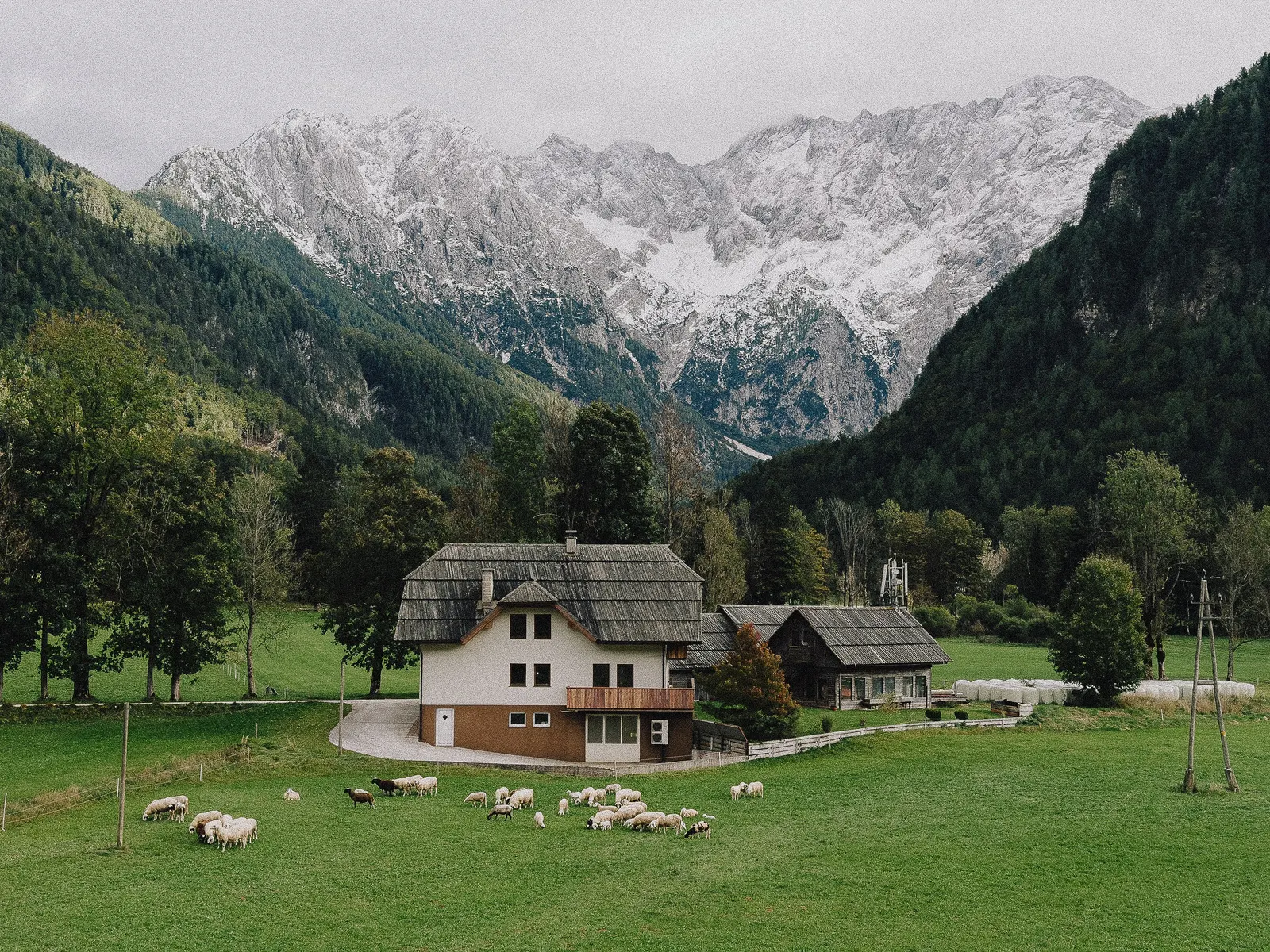 An alpine village under the first snow on the peaks.