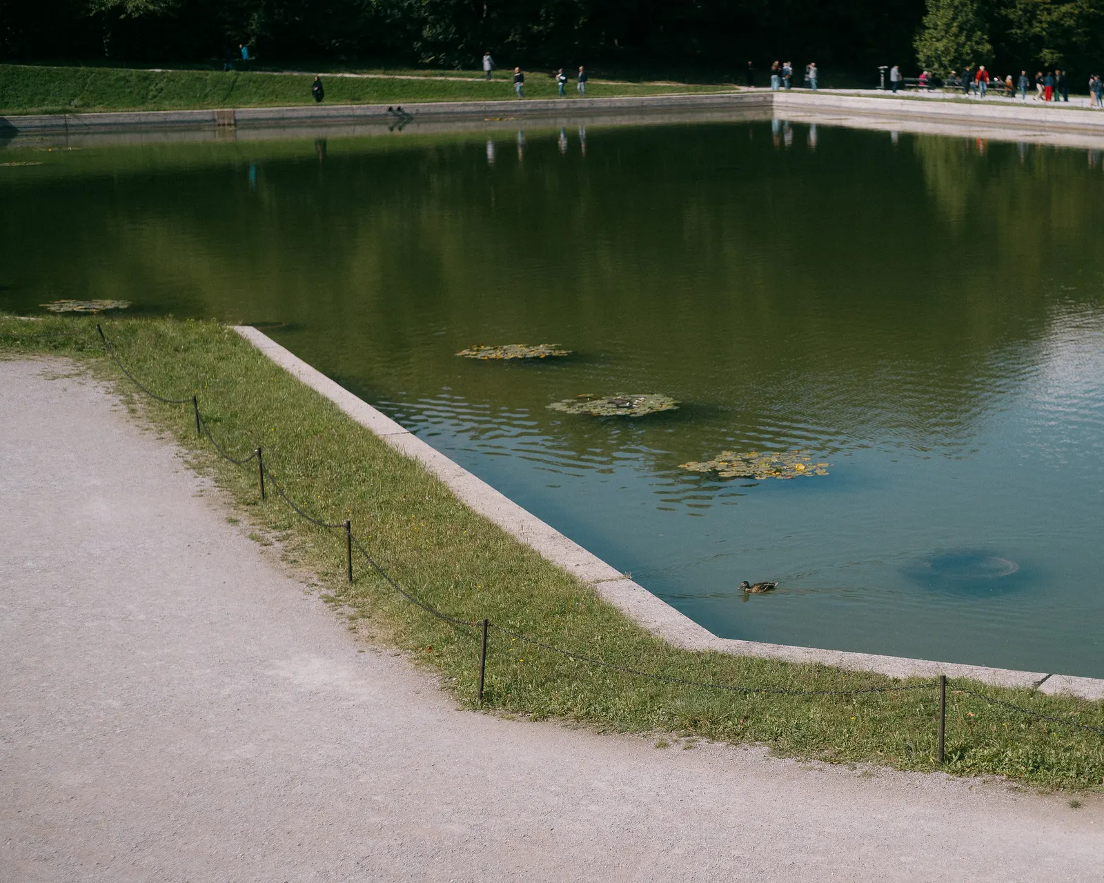 The reflecting pool in a formal garden, drained for the season.