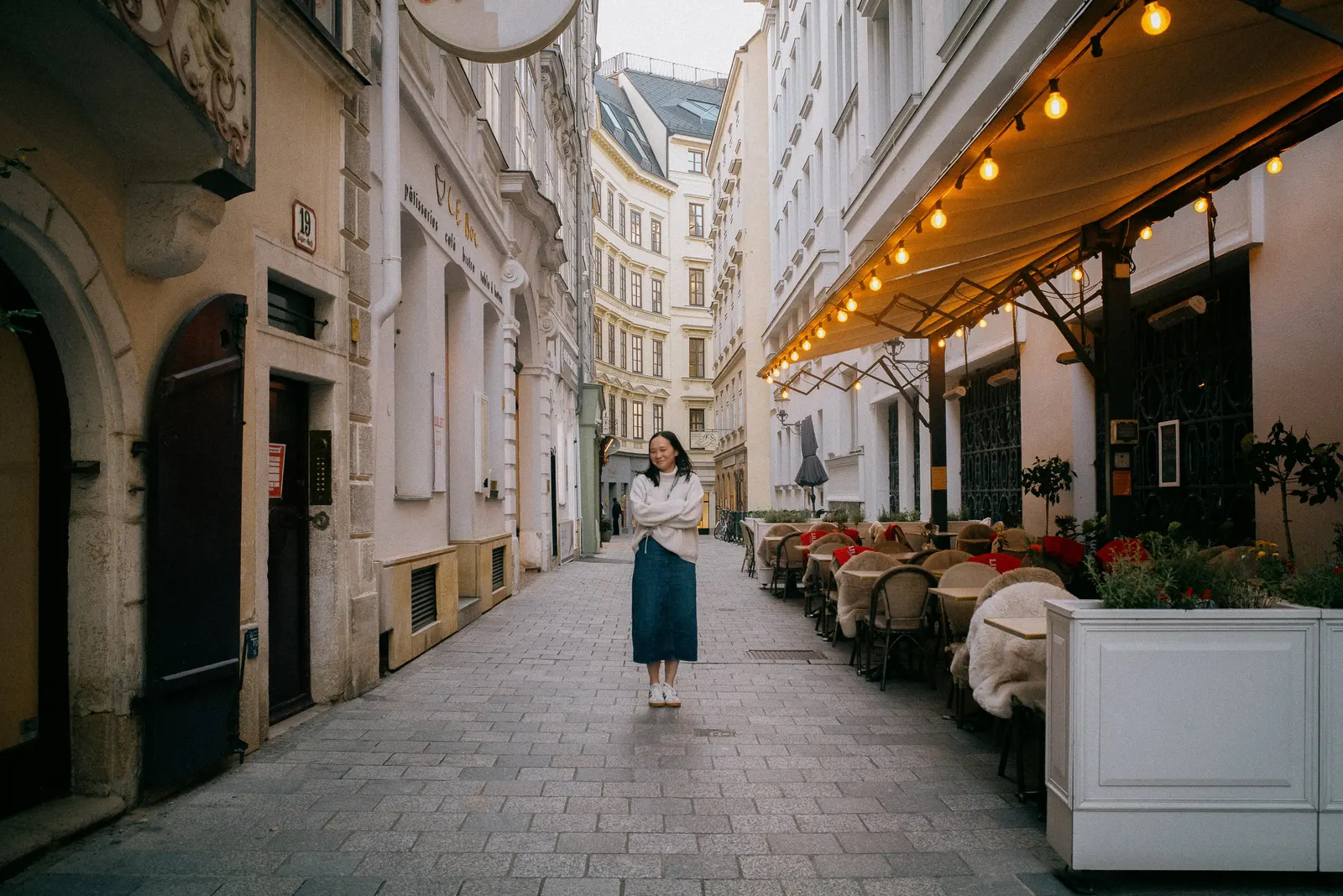 An old-town lane under the shop lamps.