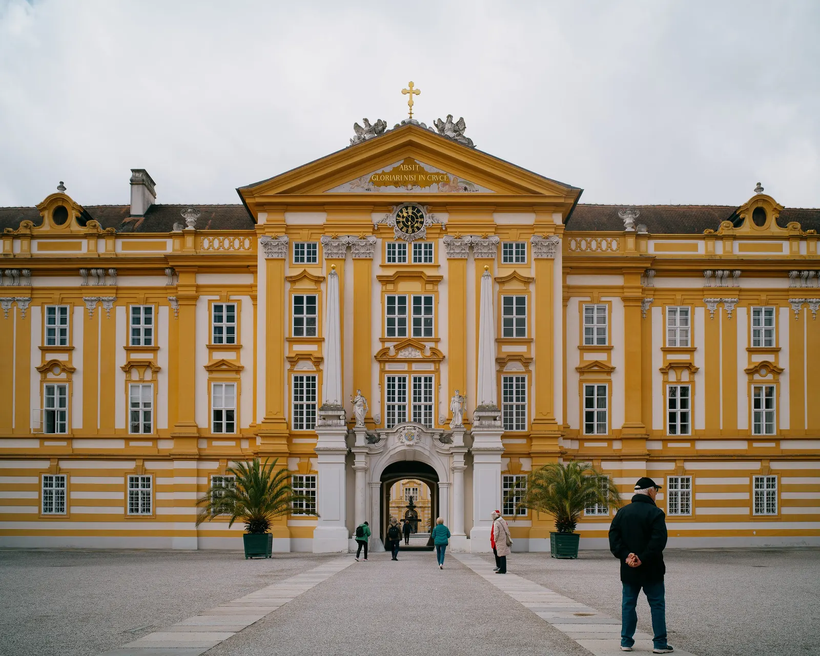 Melk Abbey, and a single figure crossing the forecourt.