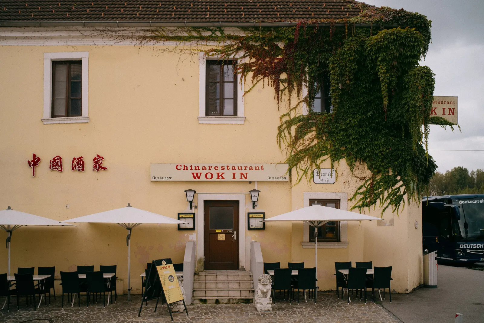 A small restaurant tucked under the baroque wall.