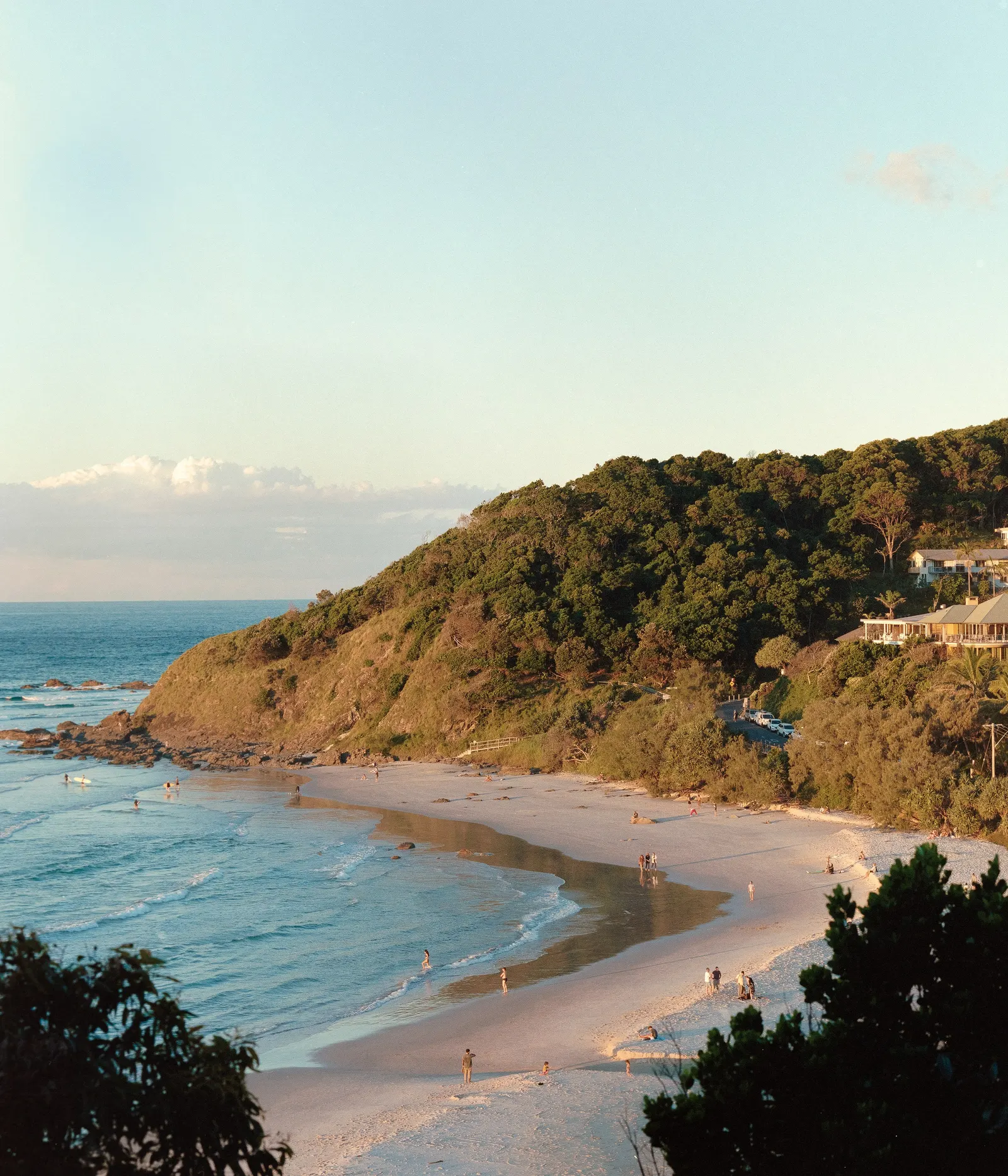 The headland dropping down to the beach.